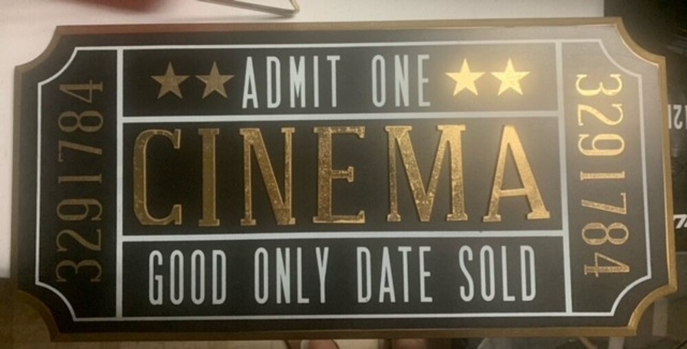 Gold and Black Cinema Sign